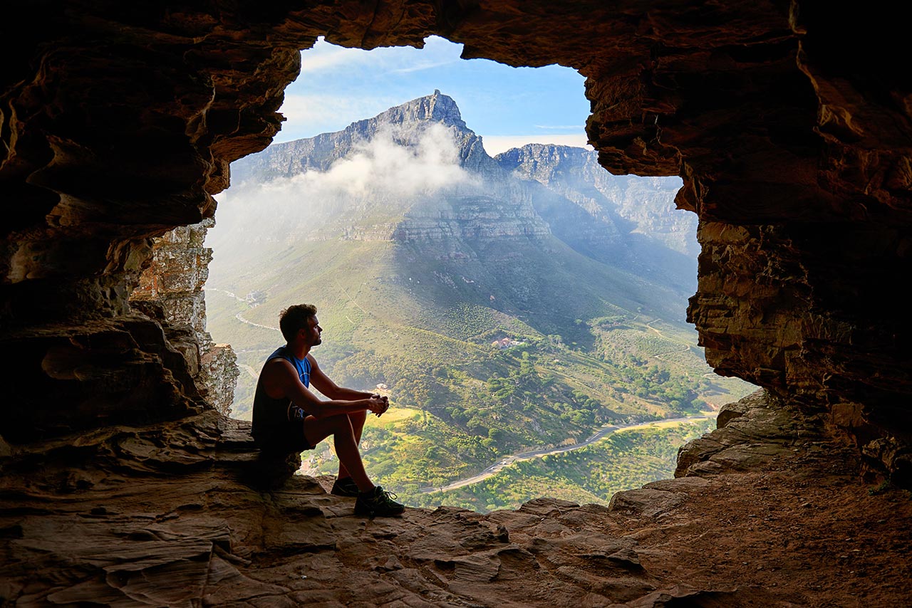 Man Sitting in Cave Thinking of the Nomadic Lifestyle 