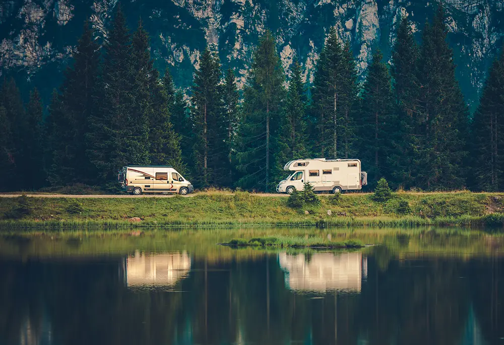 RV and van boondocking by mountains and lake
