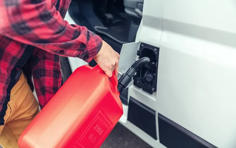 Person filling up RV with fuel